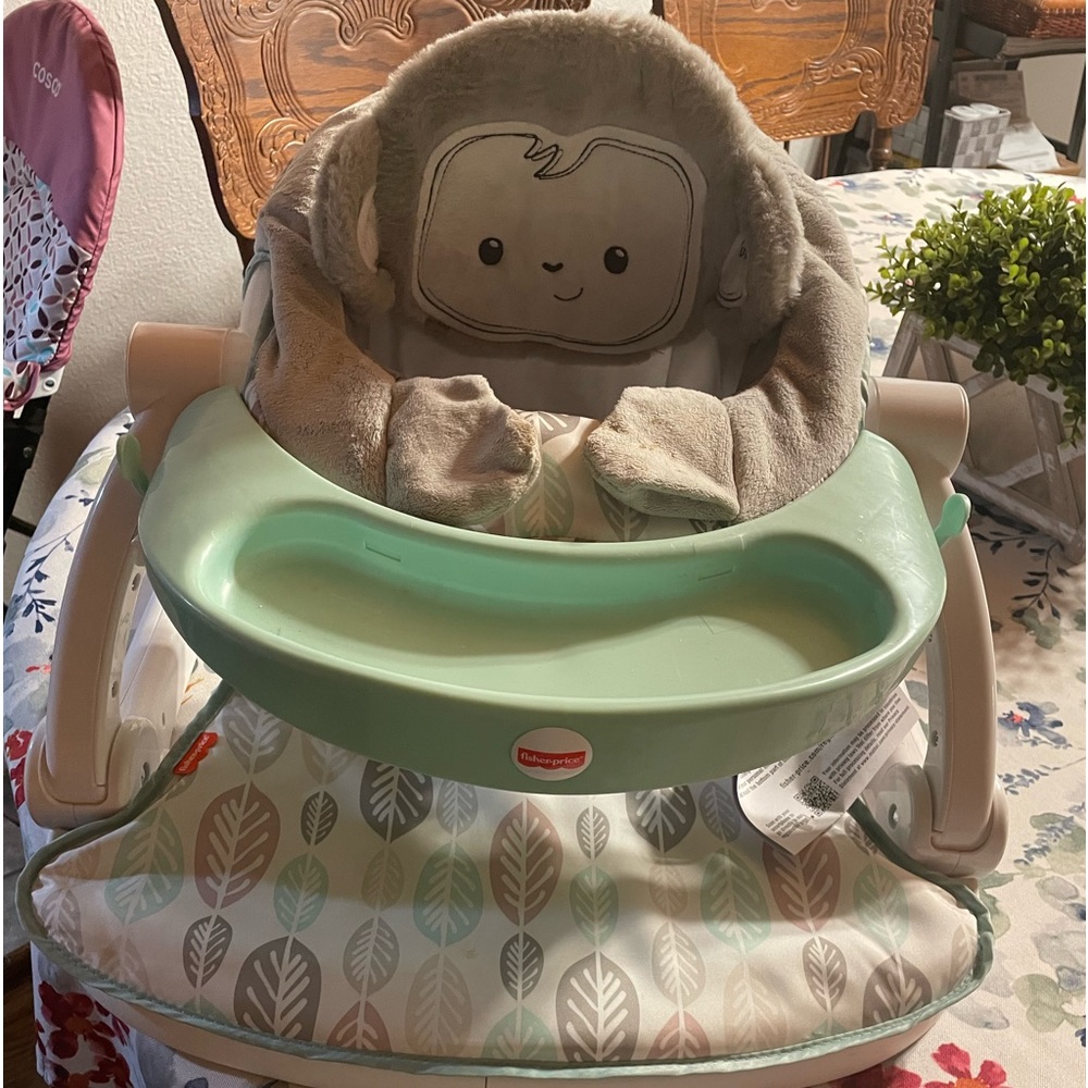 Fisher Price baby seat. Only used few times. Use on floor,chair,and table.